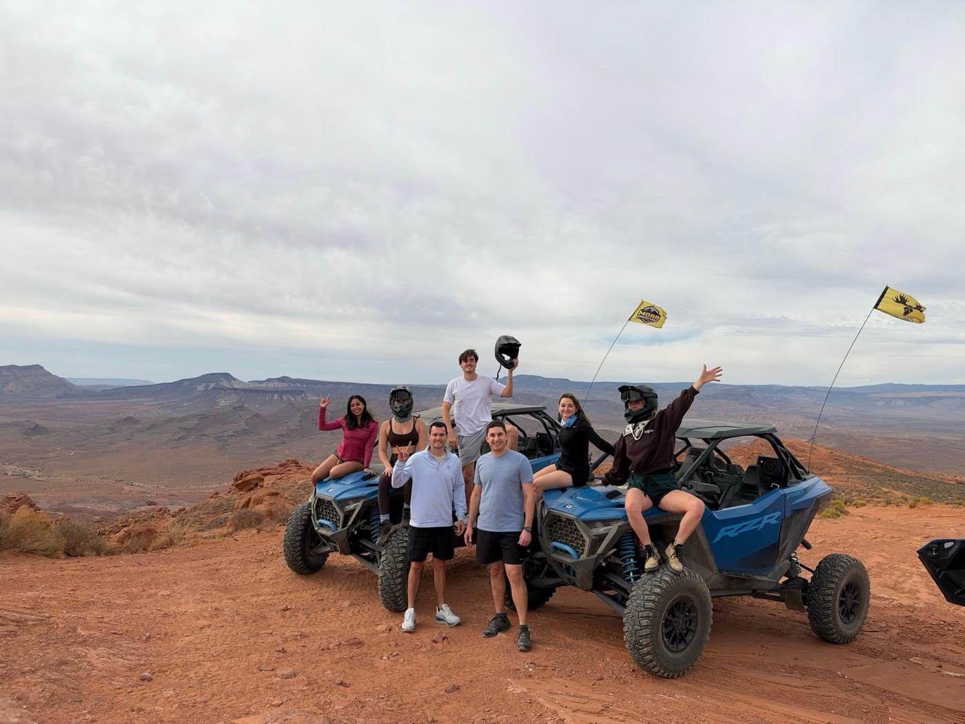 ITG team with dune buggies at a Sand Hollow overlook in Utah